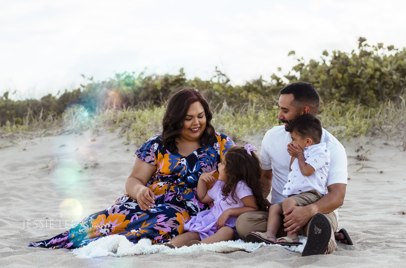 Family photographer pompano beach lighthouse point family sitting at beach jessie lee photography