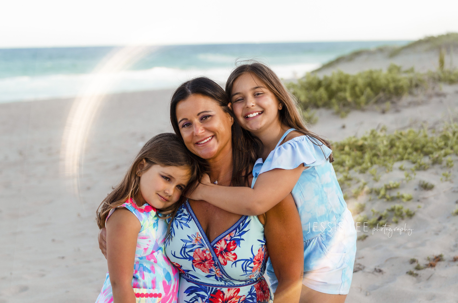 Family photographer pompano beach lighthouse point mom with daughters at beach jessie lee photography